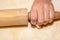 Little girls hand with rolling pin and flour