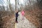 Little girls hiking through autumn forest