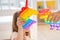 Little girls,kids,sisters play with colorful pop it children room,bedroom.Funny trendy silicone antistress colorful sensory push