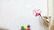 Little girls near blackboard in elementary school. Kids playing with colorful magnets on white board