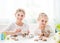 Little girls showing homemade Easter cookies