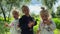 Little girls triplets with dandelions