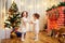 Little girls twins children Christmas dancing, having fun, laugh
