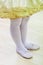 Little girls in yellow ballet tutu dress and pink ballet shoes