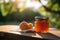 little glass jar with apricot jam on a wooden table against the background of green trees in summer. Generative AI