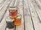 Little glass of various honey  on wooden table