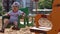 Little handsome boy in glasses rides on carousel