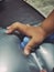 Little handâ€‹ ofâ€‹ the baby pushing the electronic massage pillow with fun play enjoy in the house to the the afternoon