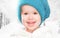 Little happy baby child girl in white hat in winter