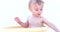 Little happy baby. Child playing in bowl with water.