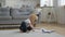 Little happy boy child playing with white passenger toy plane with glasses and pilot cap, pilot lands plane on ground