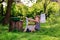 Little helper girl washes clothes using the washboard outdoors