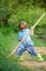 Little helper working in garden. Cute child in nature having fun with shovel. I want to find treasures. Little boy with