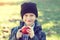 Little hipster schoolboy holding apple