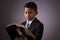 Little Hispanic Boy Reading the Holy Scriptures, The Bible, The Word of God