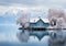 A little house in the middle of the water with mountains in the background. Color palette with the essence of nature. Winter time