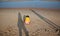 Little hurt child and parents shade on the beach