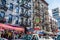 Little Italy Neighborhood in Lower Manhattan, New York City. Busy Street with Touristic Gift Shops and Traffic Jam.