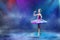 A little Japanese ballerina dances on stage in a lilac tutu on pointe shoes classical ballet