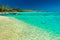 Little jetty and boat on tropical beach with amazing water, Moor