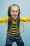 Little kid with a bee costume on carnival. Happy little boy. Close-up. Adorable baby having fun. Funny boy. Happy