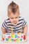 Little kid blows a candle on the cake on his birthday