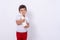 Little kid with bottle milk isolated background. Four years boy holding milk from from the farm.