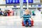 Little kid boy going on vacations trip with suitcase at airport