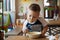 Little kid boy having supper or dinner in hotel restaurant or city cafe