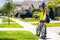 Little kid boy ride a bike in the park. Kid cycling on bicycle. Happy smiling child in helmet riding a bike. Boy start