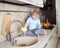 Little kid boy washing dish on kitchen