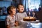 Little kid boys twins celebrating birthday and blowing candles on cake