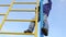 Little kid climbing on ladder in playground