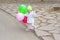 Little kid with colourful balloons