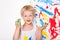 Little kid draws bright colors. School. Preschool. Education. Creativity. Studio portrait over white background