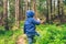 Little kid eat blueberry in the forest