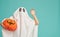 Little kid in ghost costume