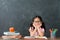 Little kid girl back to school sitting in class