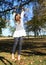 Little kid - girl hanging on branch