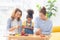 Little kid girl spending happy time with grandma, Child playing toys and game at home with positive senior grandparents in living