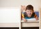 Little kid laughing on top of bunk bed