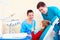 Little kid, patient checking the result of medical procedure in dental clinic