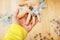 Little kid playing with puzzles on wooden floor together with parent, lifestyle people concept, loving hands to each