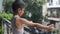 Little kid playing in summer rain in house balcony, Indian smart boy playing with rain drops during monsoon rainy season, kid