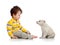 Little kid and puppy looking at each other on whit