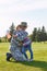 Little kid with usa flag is embracing her father.