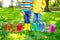 Little kids, boys and girls in colorful rain boots. Close-up of children in different rubber boots, jeans and jackets