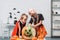 little kids in halloween costumes near table with pumpkins