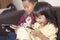 Little kids sister and brother siblings plays on gadget smart phone
