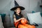 Little kids southeast asian on halloween dressed in a witch costume